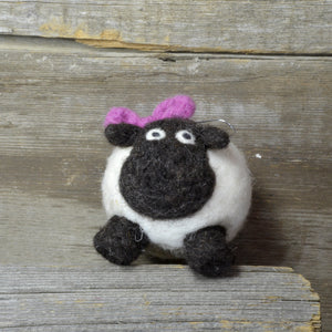 sheep with bow ornament